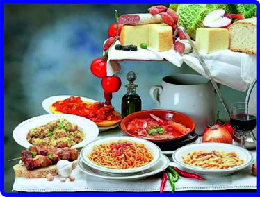 L’enogastronomia in Abruzzo è una componente fondamentale dell’identità regionale e rappresenta oggi uno dei motivi di viaggio per un numero crescente di turisti interessati alle esperienze autentiche e alla scoperta dei territori attraverso il gusto. Dalla costa adriatica alle aree collinari fino alle montagne dell’Appennino, la cucina abruzzese racconta una storia fatta di tradizioni rurali, cultura marinara e prodotti legati alla stagionalità. Tra le specialità più conosciute spiccano gli arrosticini, simbolo della tradizione pastorale, insieme a salumi, formaggi, pasta fresca e ricette della cucina contadina tramandate di generazione in generazione. Lungo la costa, il patrimonio gastronomico si arricchisce delle specialità a base di pesce dell’Adriatico, con il brodetto e le numerose preparazioni della tradizione marinara protagonisti delle tavole locali. Il territorio offre inoltre una straordinaria varietà di prodotti agroalimentari, tra cui olio extravergine di oliva, zafferano dell’Aquila, tartufo, legumi, formaggi e dolci tradizionali, espressione della biodiversità regionale. Importante è anche il patrimonio vitivinicolo, con produzioni come Montepulciano d’Abruzzo, Cerasuolo d’Abruzzo e Trebbiano d’Abruzzo, sempre più protagoniste di itinerari enogastronomici e degustazioni nelle cantine del territorio. Agriturismi, ristoranti, aziende agricole, frantoi e cantine contribuiscono a trasformare la gastronomia in una vera esperienza turistica, permettendo ai visitatori di conoscere direttamente produttori e tradizioni locali. Sagre, feste popolari, mercati e manifestazioni dedicate ai prodotti tipici rappresentano inoltre occasioni per scoprire il patrimonio gastronomico abruzzese attraverso eventi che coinvolgono intere comunità. Il turismo enogastronomico diventa così un ponte tra costa ed entroterra, capace di valorizzare piccoli borghi, paesaggi rurali e produzioni di qualità anche al di fuori della stagione estiva. Dalla tavola alla cantina, l’Abruzzo offre un viaggio nel gusto che unisce autenticità, territorio e cultura, trasformando ogni specialità in un racconto della regione e in un’opportunità per vivere una vacanza più consapevole e immersiva.